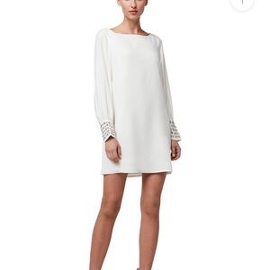 Beautiful white shift dress with embellished sleeves